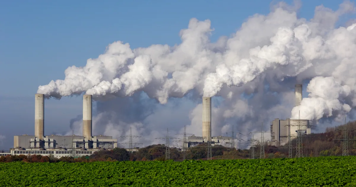 Industrial smokestacks releasing emissions